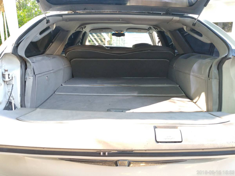 Illustration for article titled At $7,500, Would You Go To Town In This Custom 2000 Lincoln Town Car Station Wagon?